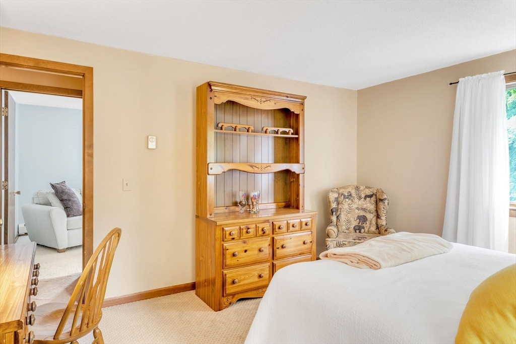 81 Munn Road Monson, MA 01057 - Photo 32 of 42 a bedroom with a bed and furniture