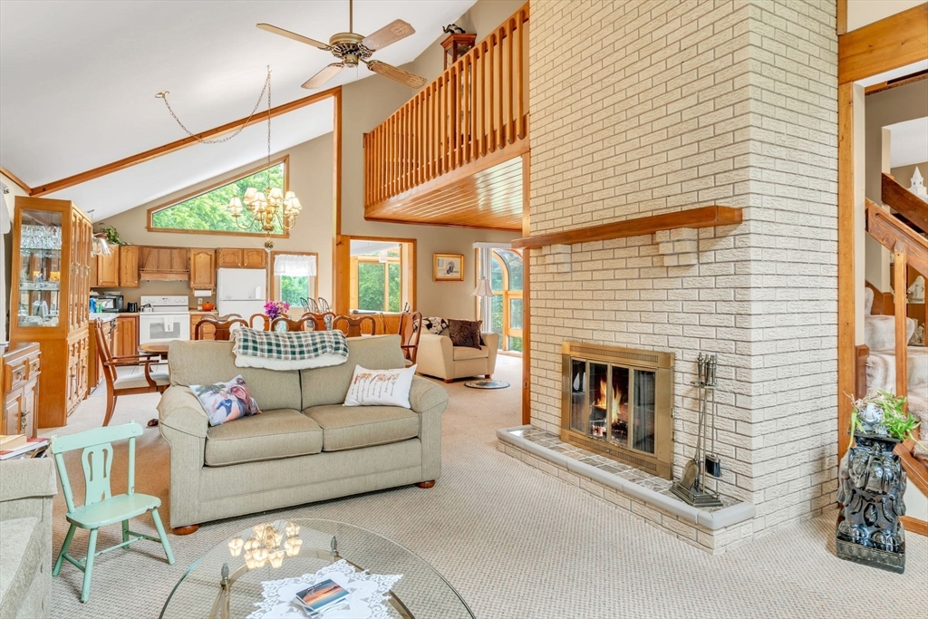 81 Munn Road Monson, MA 01057 - Photo 7 of 42 a living room with furniture a fireplace and a dining table