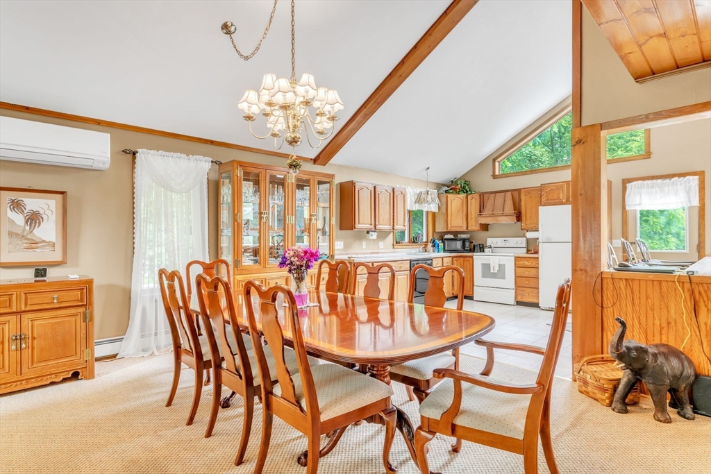 81 Munn Road Monson, MA 01057 - Photo 10 of 42 a dining room with furniture a chandelier and window