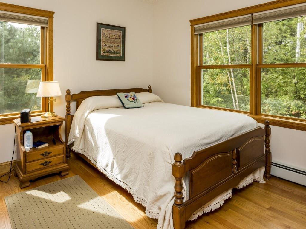 43 Pasture Lane Boothbay, ME 04571 - Photo 21 of 35 Guest bedroom with closet and wood floor