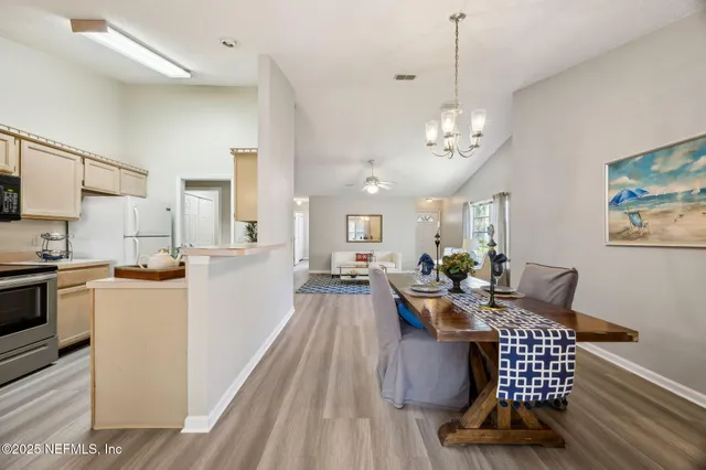 a kitchen with stainless steel appliances a stove microwave and sink