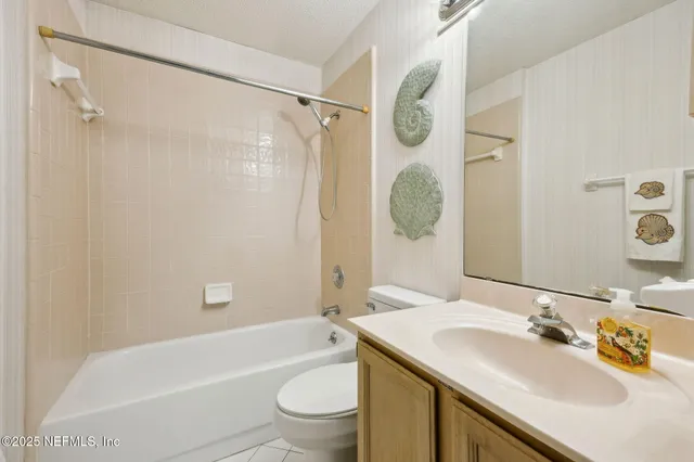 a kitchen with a sink and a refrigerator