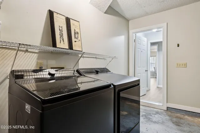 a dining room with furniture and a floor to ceiling window