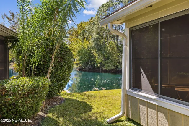 a view of a yard with swimming pool
