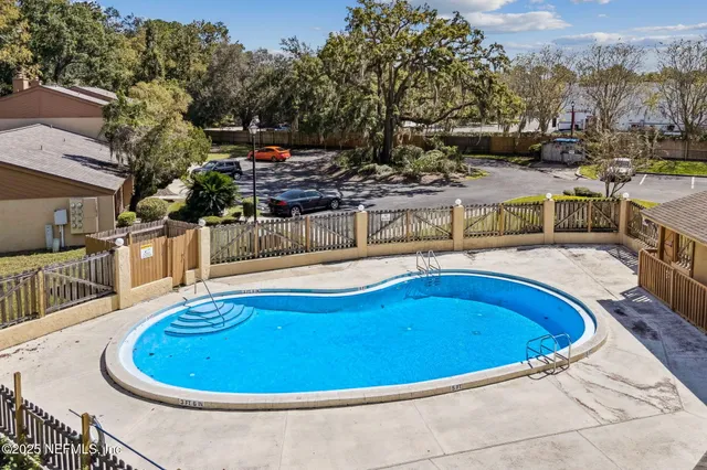 a view of a swimming pool with a patio