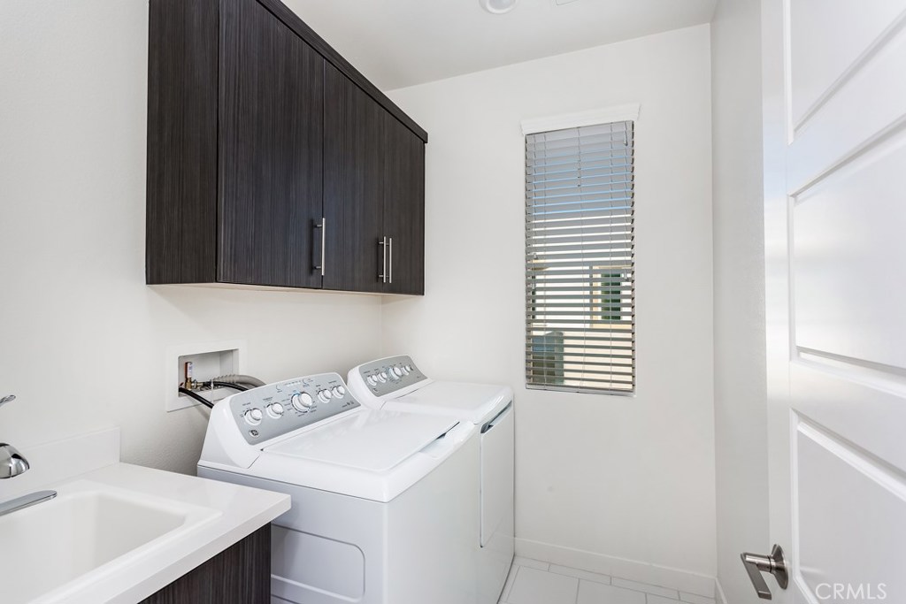 106 Newall Irvine, CA 92618 - Photo 15 of 31 a utility room with a sink washer and dryer