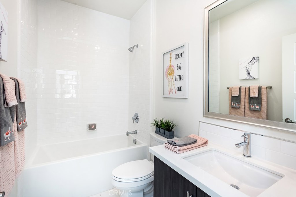 106 Newall Irvine, CA 92618 - Photo 17 of 31 a bathroom with a sink a toilet a tub and shower