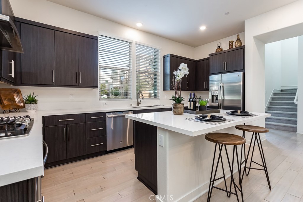106 Newall Irvine, CA 92618 - Photo 4 of 31 a kitchen with a sink a stove and cabinets