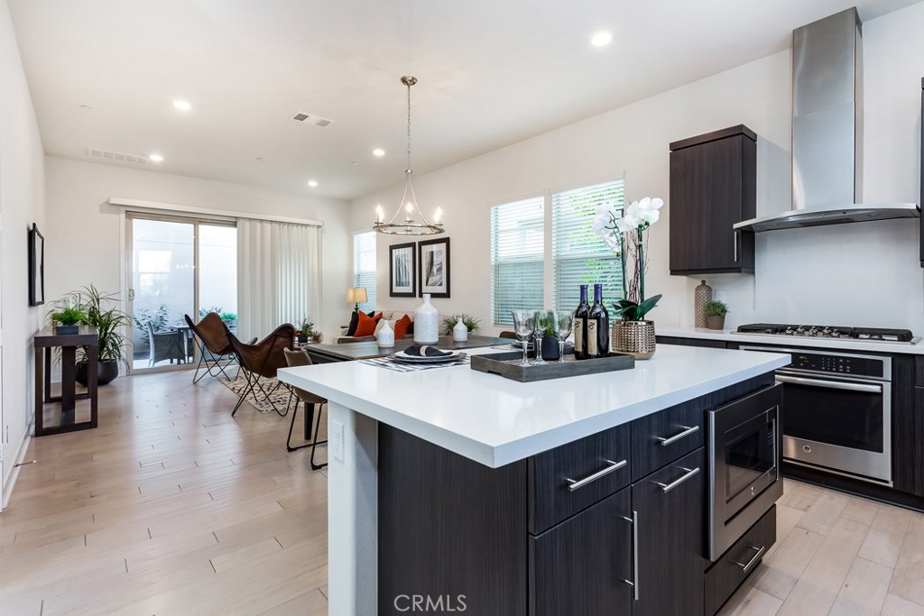 106 Newall Irvine, CA 92618 - Photo 5 of 31 a kitchen with a sink stove and chairs