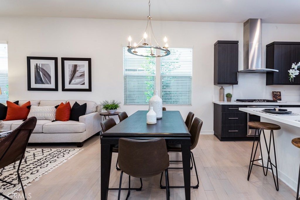 106 Newall Irvine, CA 92618 - Photo 6 of 31 a view of a dining room with furniture and a chandelier