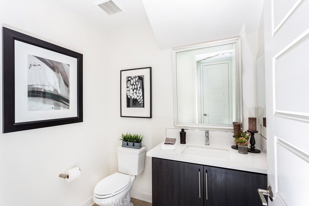 106 Newall Irvine, CA 92618 - Photo 8 of 31 a bathroom with a sink a toilet and mirror