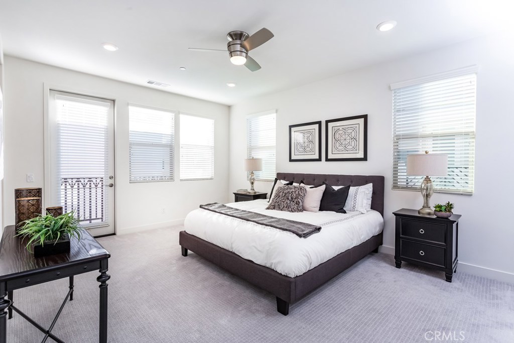106 Newall Irvine, CA 92618 - Photo 10 of 31 a spacious bedroom with a bed a dresser and a window