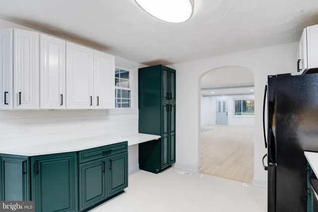 a kitchen with stainless steel appliances a sink stove and refrigerator