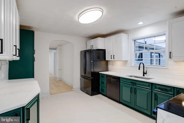 a kitchen with stainless steel appliances a refrigerator and a stove