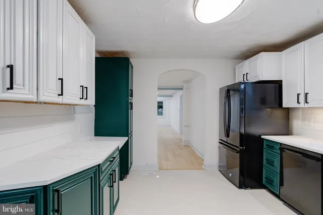 a kitchen with stainless steel appliances granite countertop a sink and a cabinets