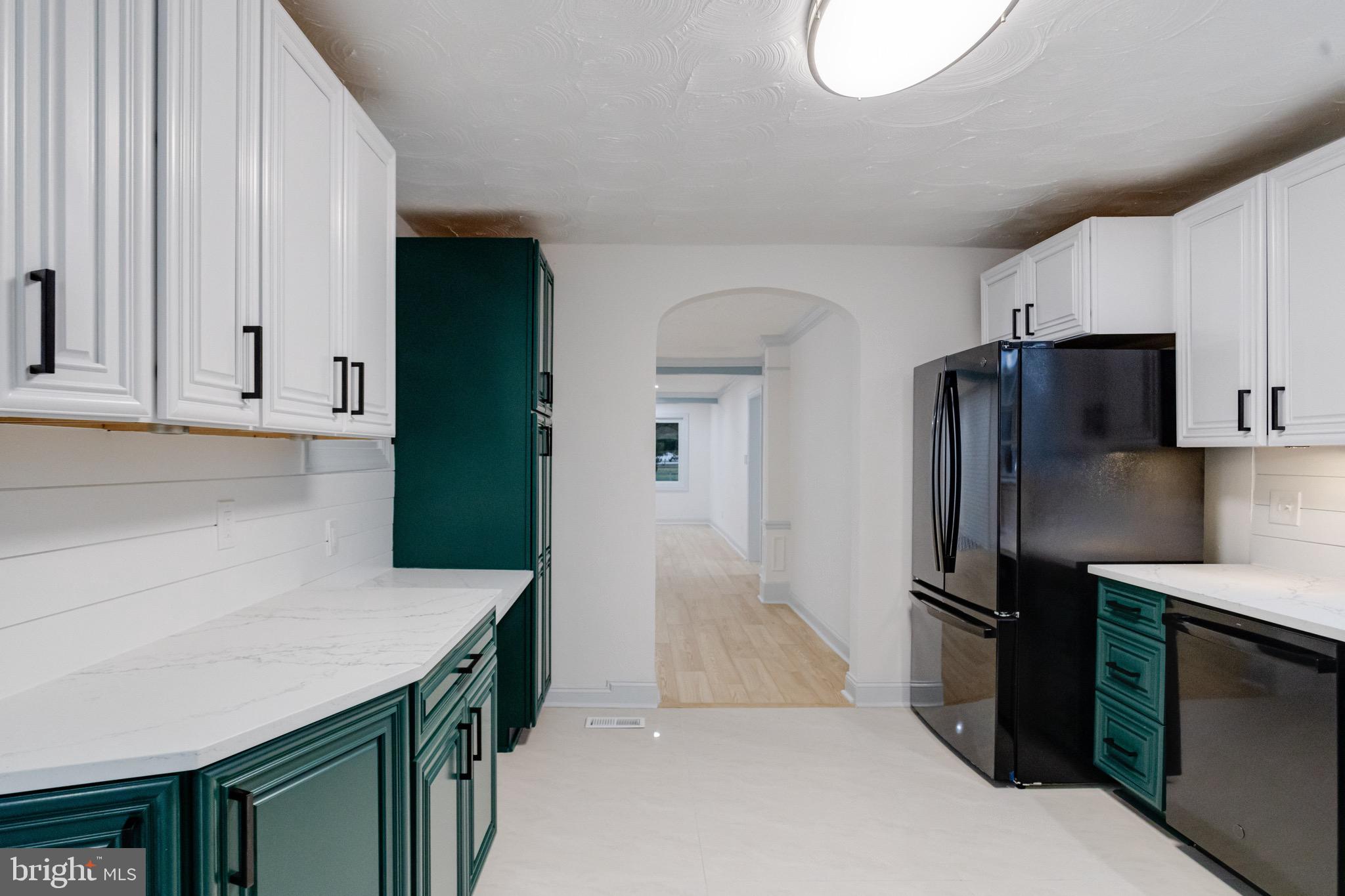 5717 Station Road White Marsh, MD 21162 - Photo 15 of 62 a kitchen with stainless steel appliances a refrigerator and a stove