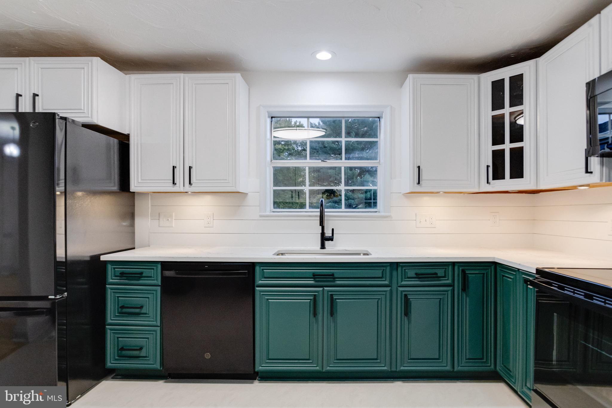 5717 Station Road White Marsh, MD 21162 - Photo 16 of 62 a kitchen with stainless steel appliances granite countertop a sink and a cabinets