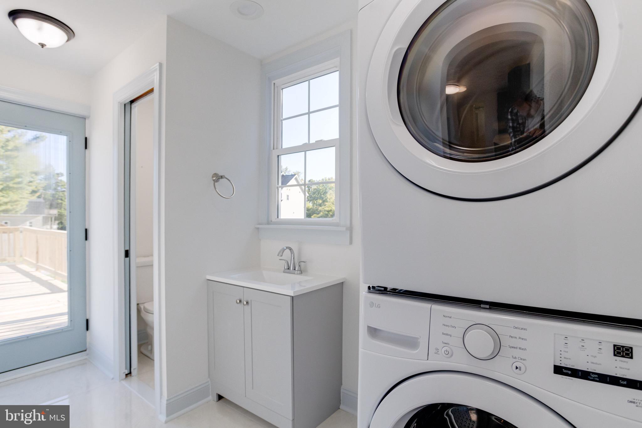 5717 Station Road White Marsh, MD 21162 - Photo 18 of 62 a view of entryway with washer and dryer
