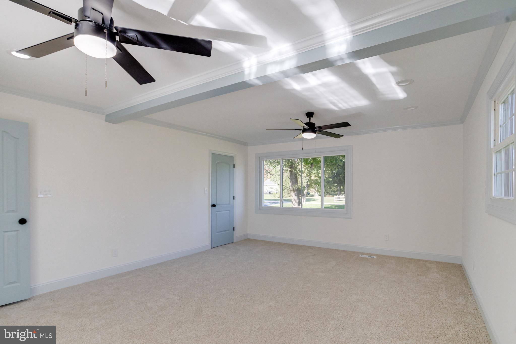 5717 Station Road White Marsh, MD 21162 - Photo 24 of 62 en empty room with windows and ceiling fan