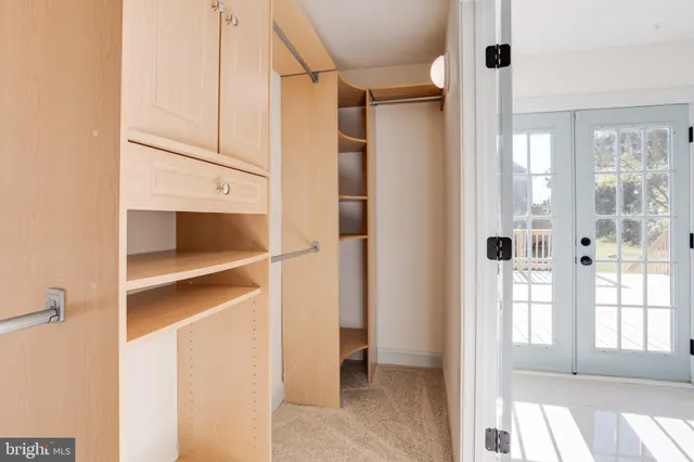a white bath tub sitting next to a shower