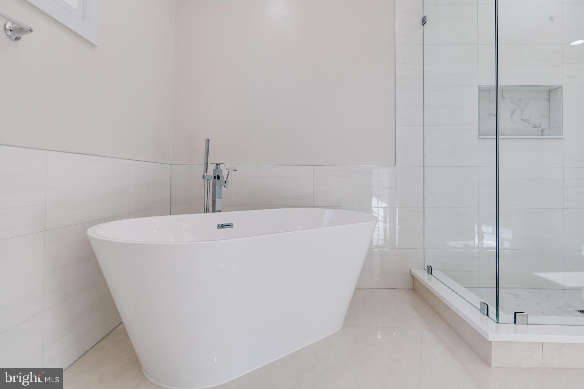 5717 Station Road White Marsh, MD 21162 - Photo 38 of 62 a white bath tub sitting next to a shower