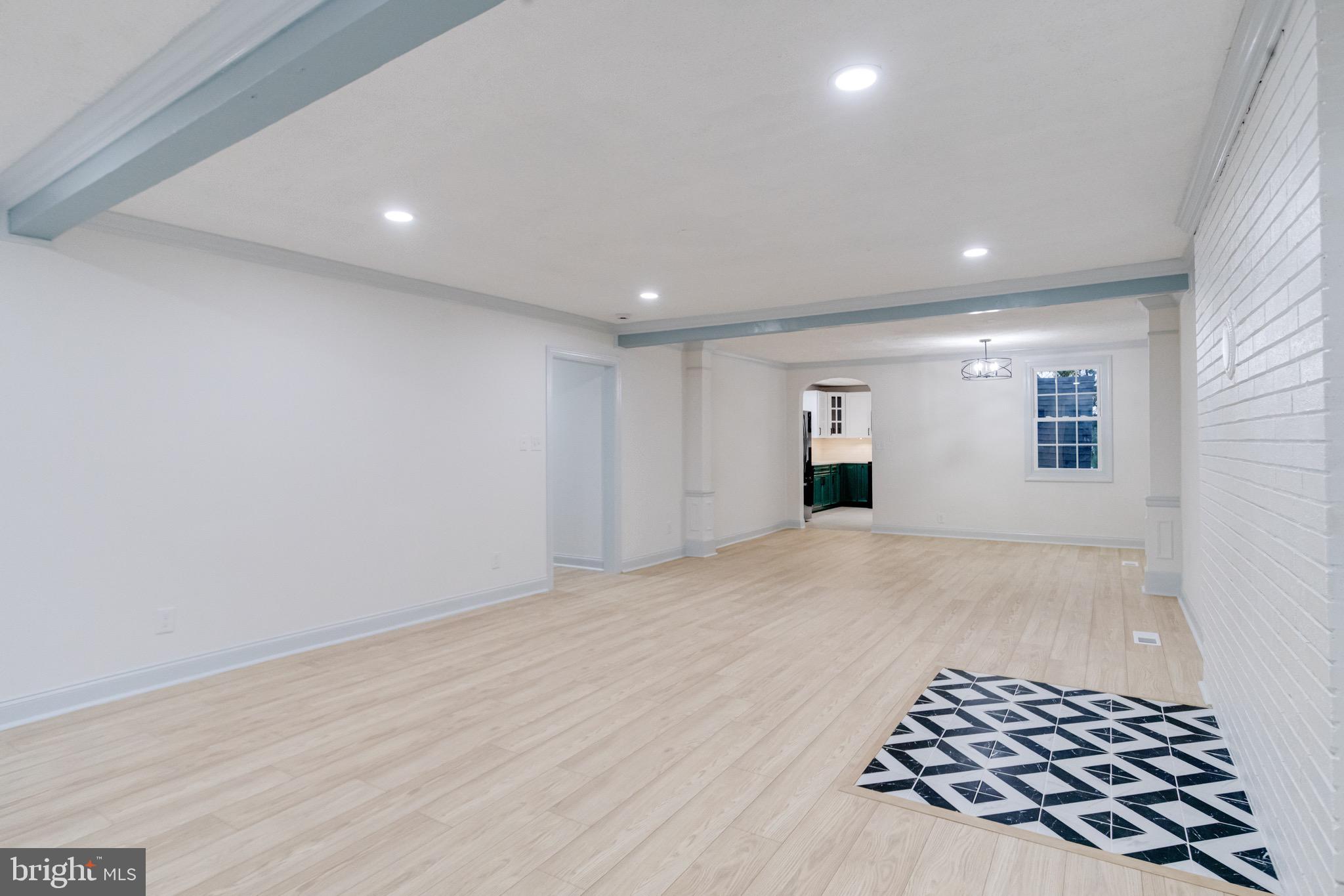 5717 Station Road White Marsh, MD 21162 - Photo 4 of 62 wooden floor in an empty room with a window