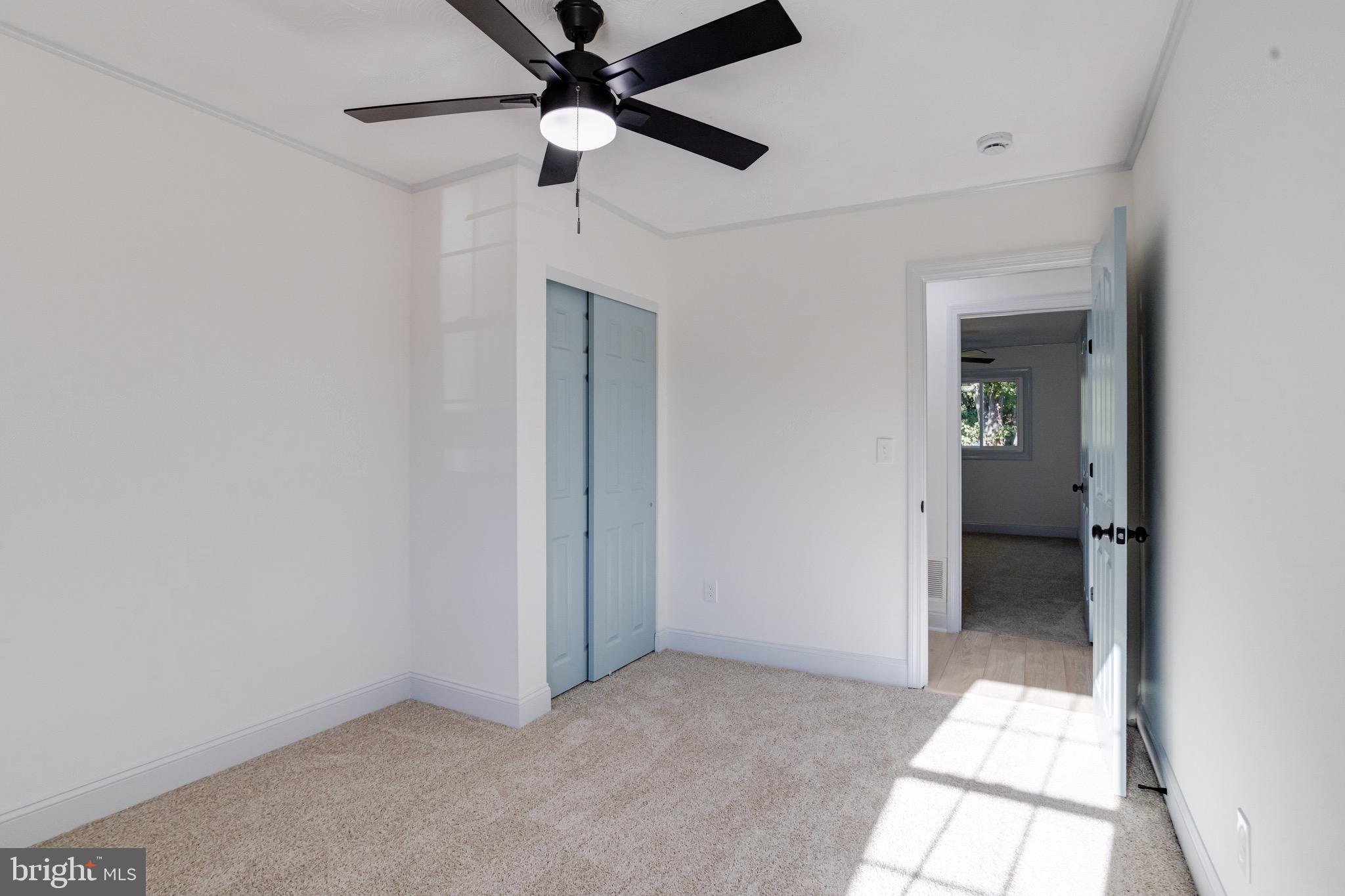 5717 Station Road White Marsh, MD 21162 - Photo 41 of 62 an empty room with closet and a chandelier fan
