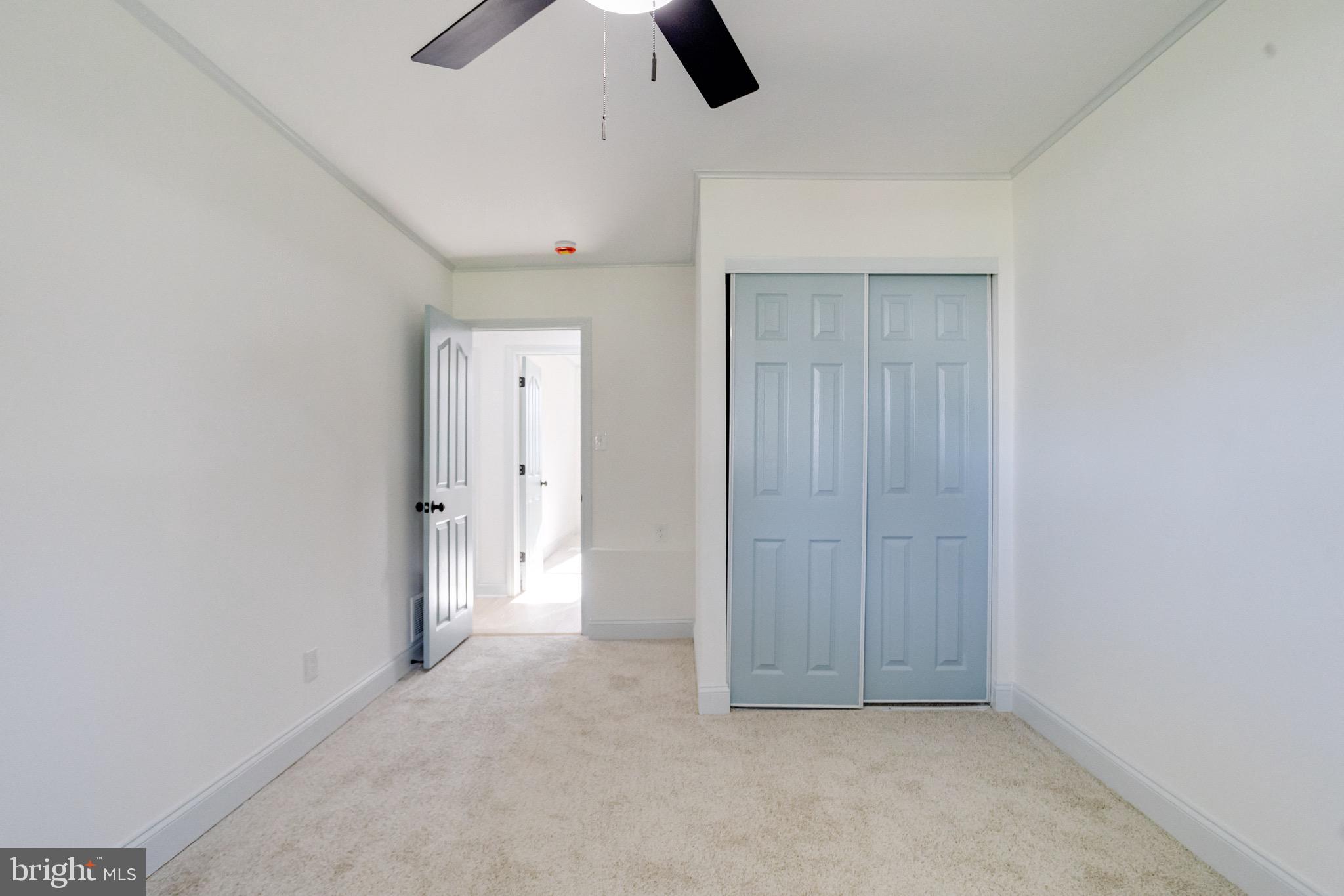 5717 Station Road White Marsh, MD 21162 - Photo 45 of 62 an empty room with closet and windows