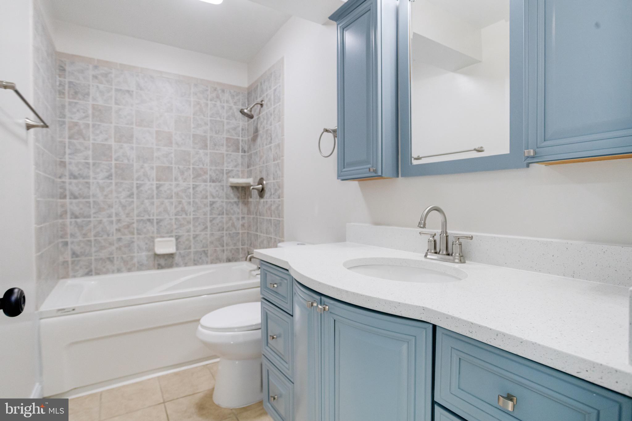 5717 Station Road White Marsh, MD 21162 - Photo 46 of 62 a bathroom with a sink a toilet and a bathtub
