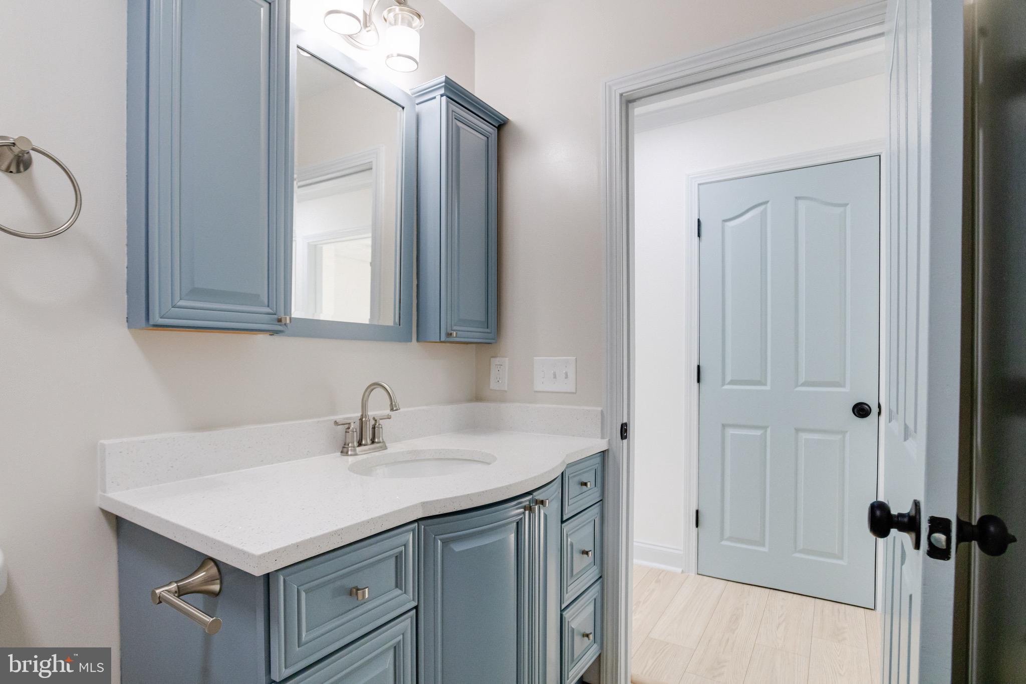5717 Station Road White Marsh, MD 21162 - Photo 47 of 62 a bathroom with a sink vanity and a mirror