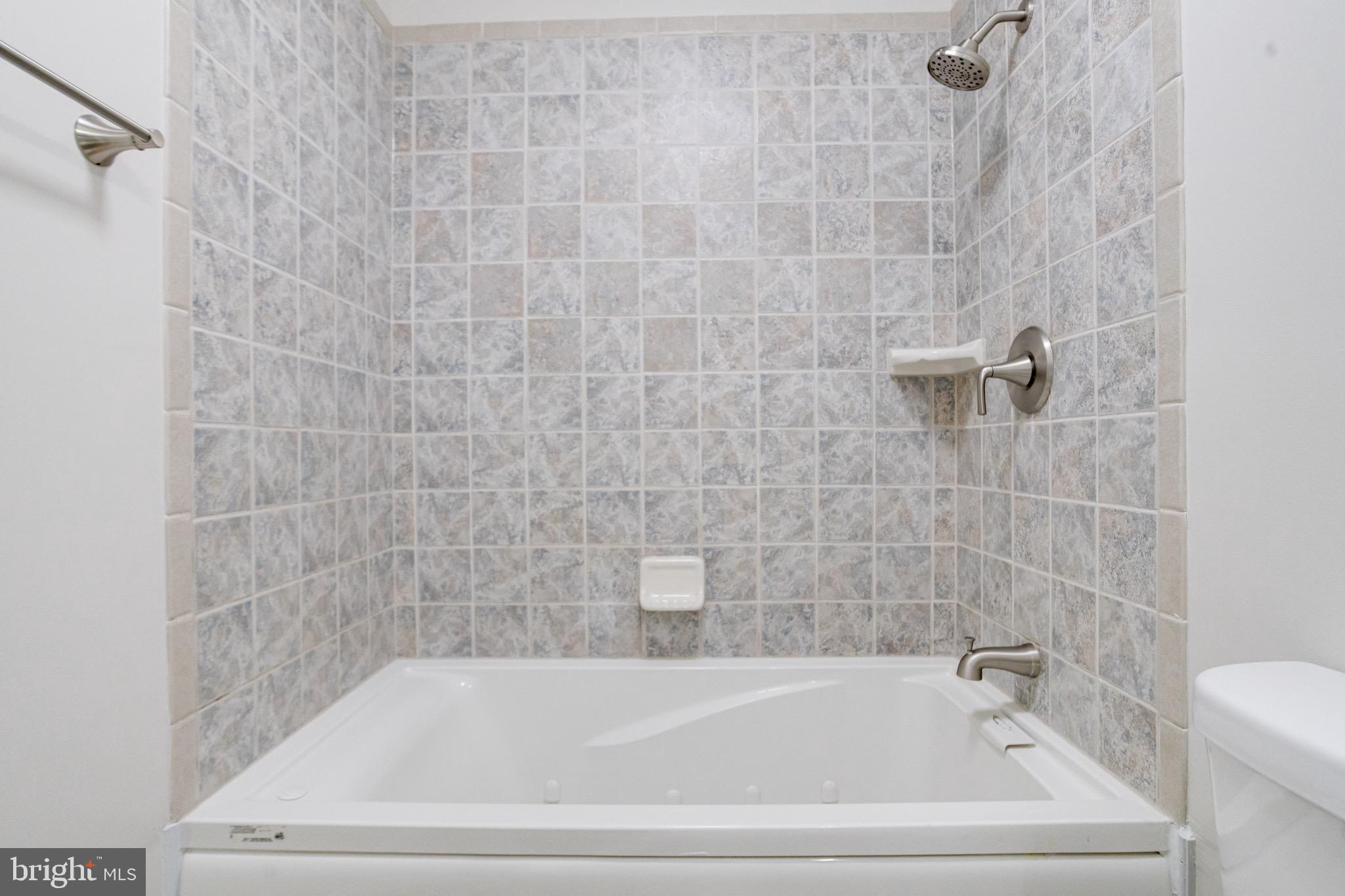 5717 Station Road White Marsh, MD 21162 - Photo 48 of 62 a bathroom with a bathtub