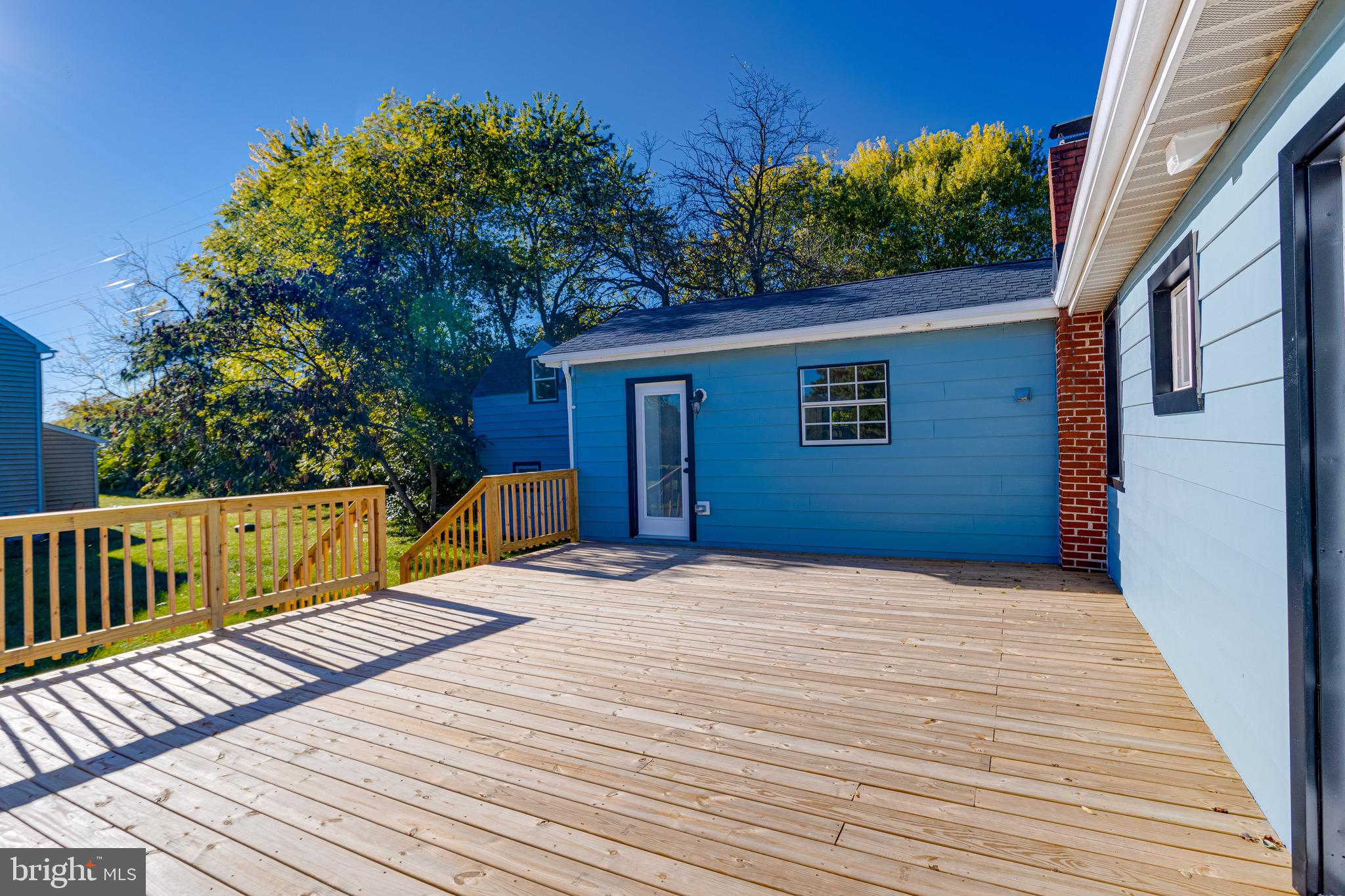 5717 Station Road White Marsh, MD 21162 - Photo 49 of 62 a view of backyard with deck and wooden floor