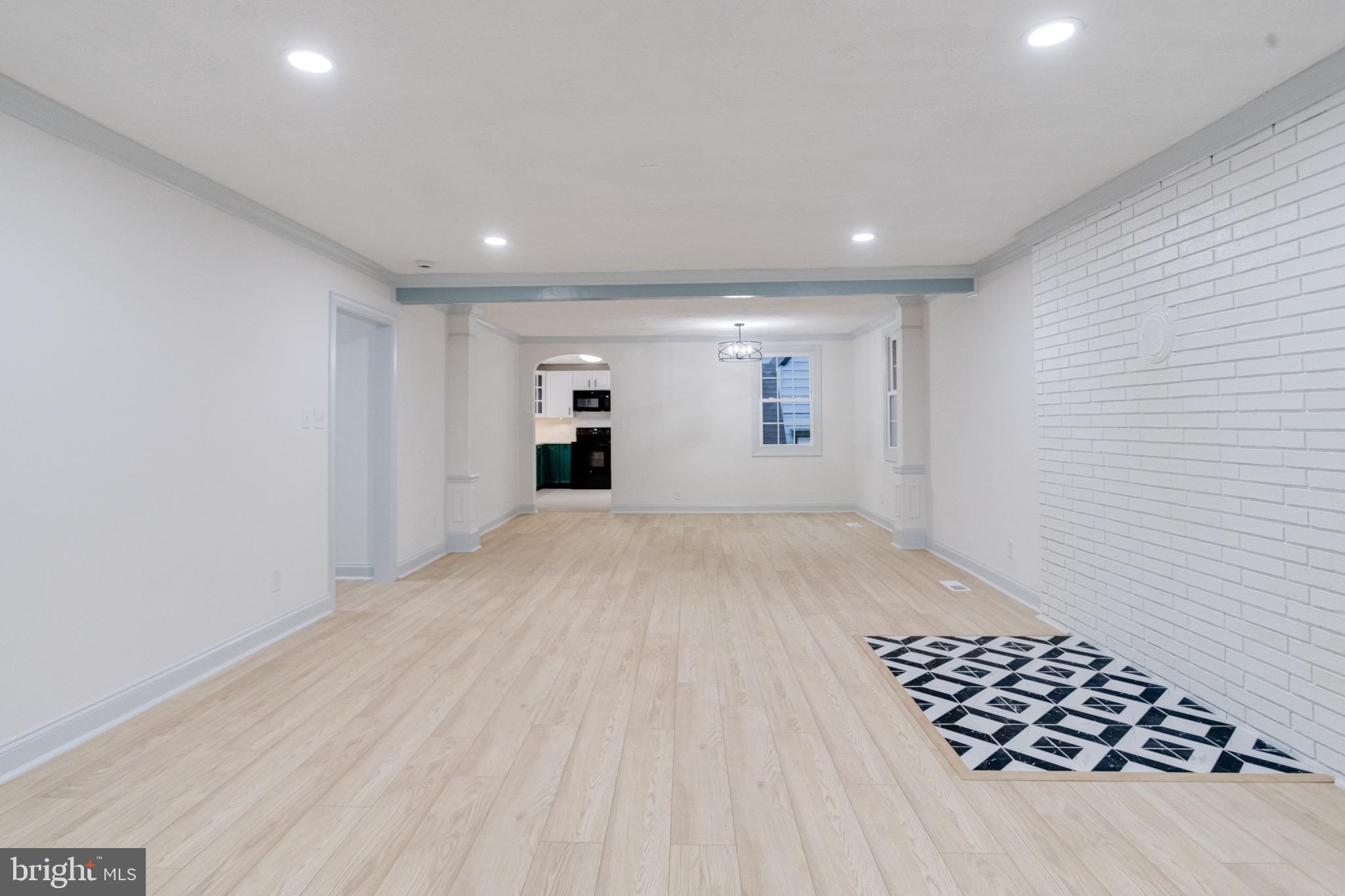 5717 Station Road White Marsh, MD 21162 - Photo 5 of 62 a view of wooden floor and windows in a room