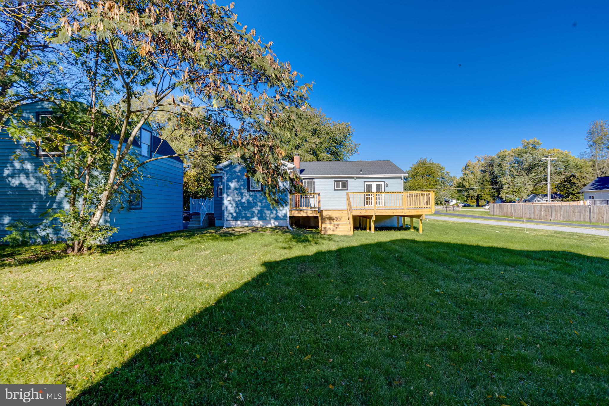 5717 Station Road White Marsh, MD 21162 - Photo 54 of 62 a front view of a house with a yard