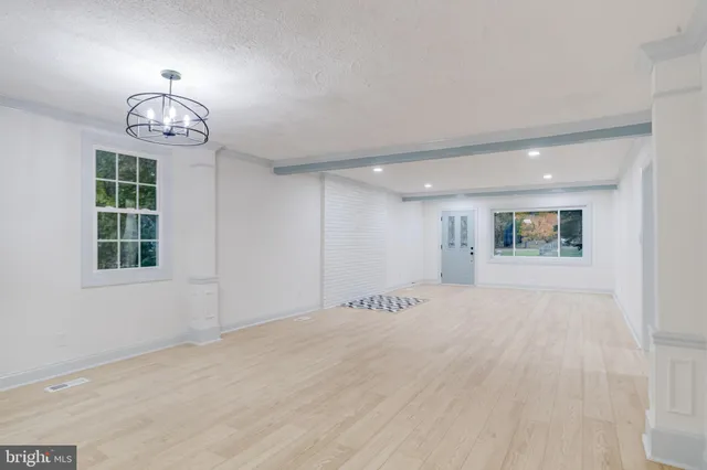 a kitchen with stainless steel appliances a refrigerator sink and cabinets