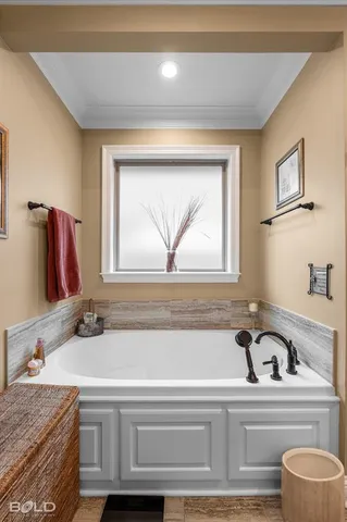 a bathroom with a granite countertop sink and a bathtub