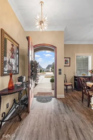 a view of a livingroom with furniture window and wooden floor