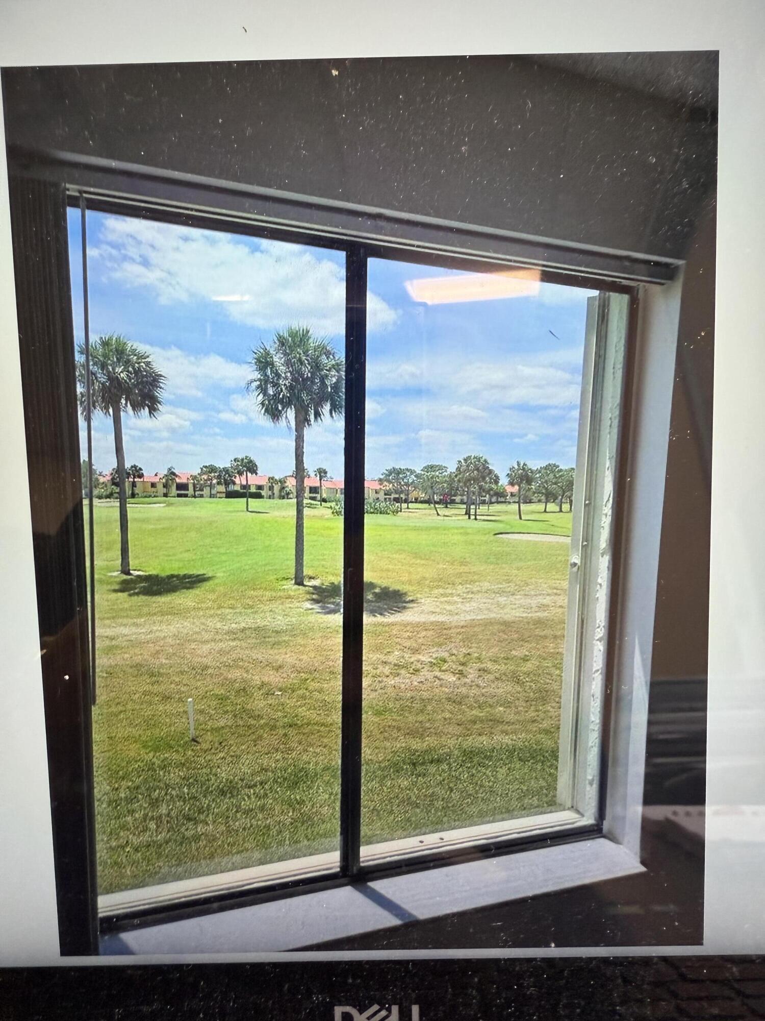5403 Southeast Miles Grant Road Stuart, FL 34997 - Photo 3 of 5 a view of a room with window