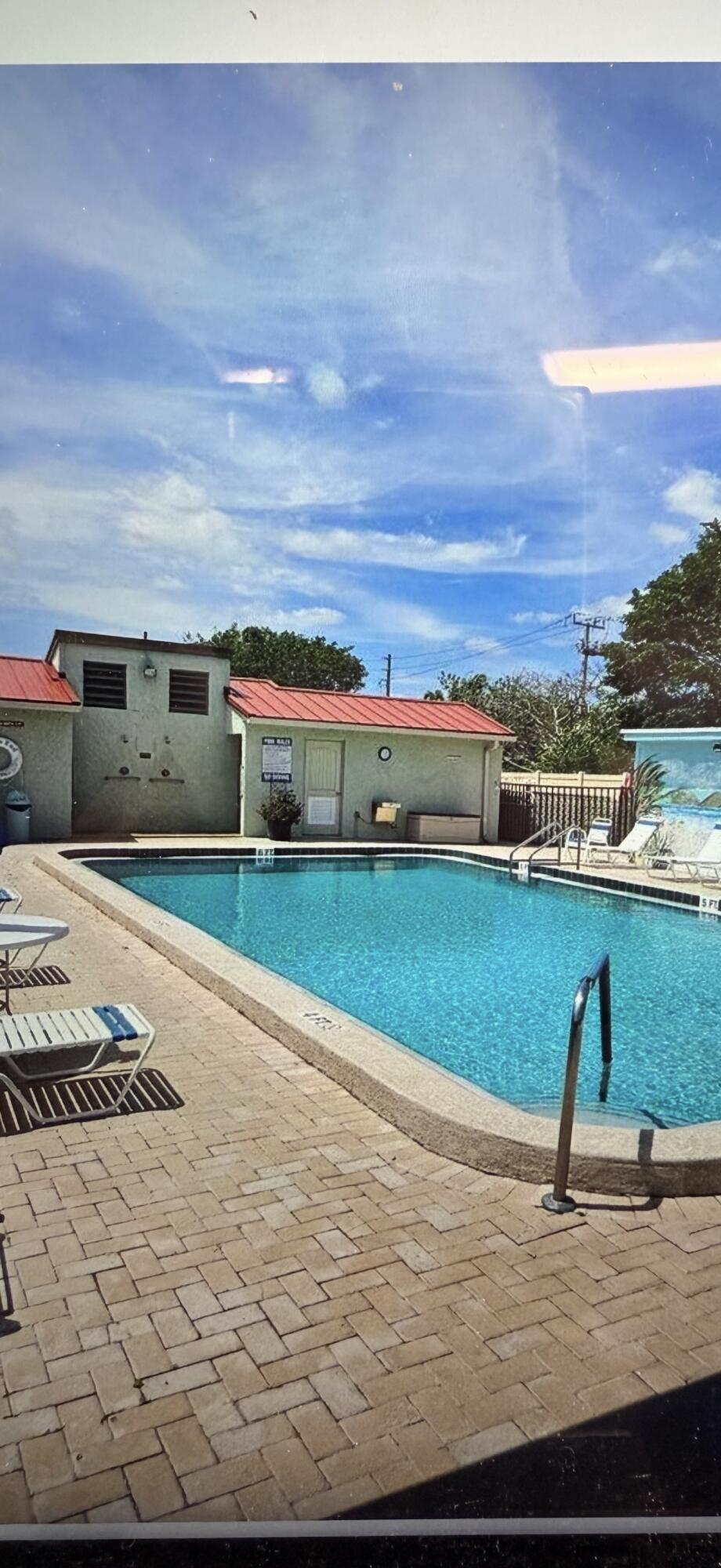 5403 Southeast Miles Grant Road Stuart, FL 34997 - Photo 5 of 5 a view of a swimming pool with an ocean view