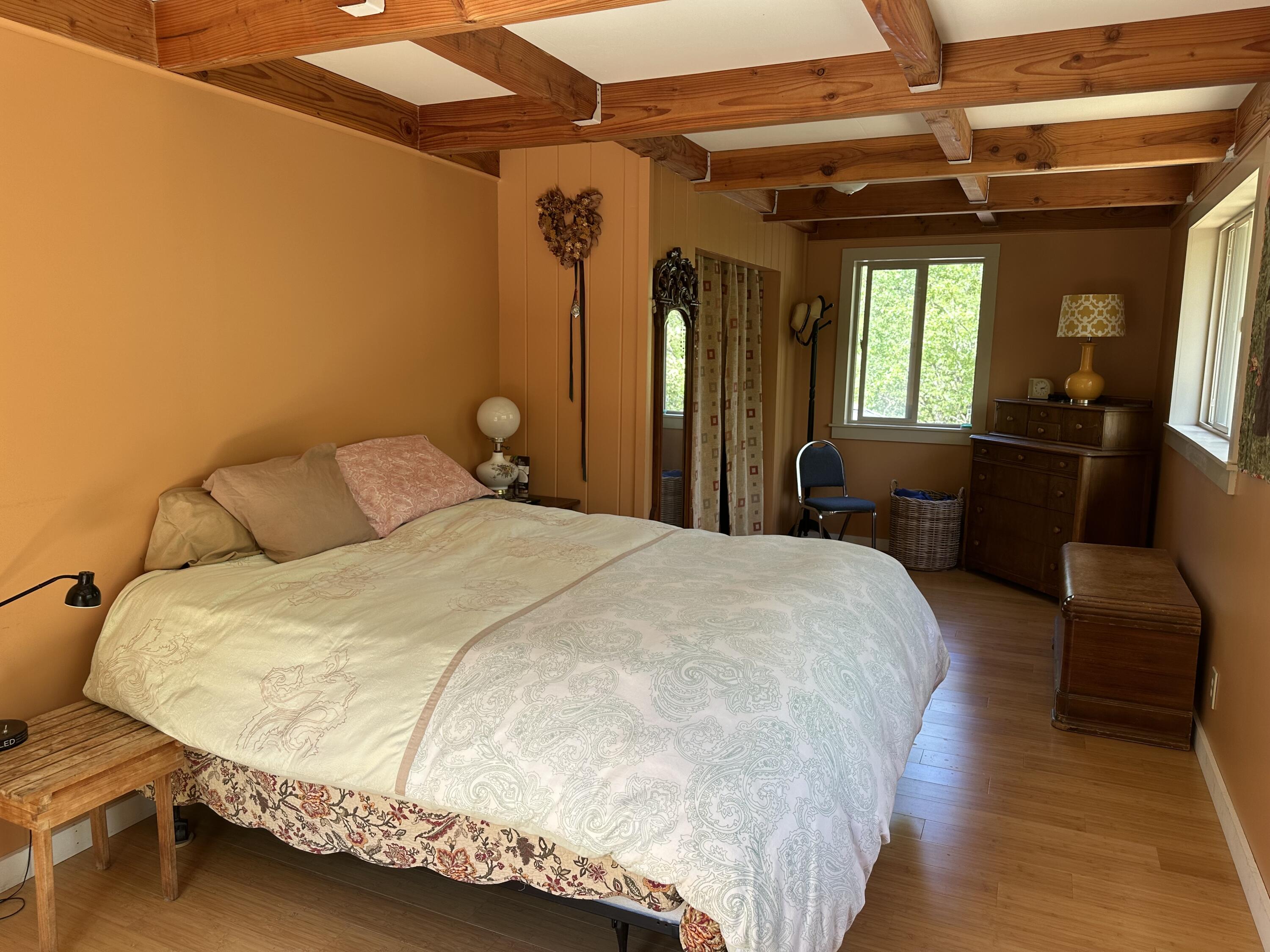 83000 Milstead Road Garberville, CA 95542 - Photo 23 of 67 a bed sitting in a bedroom next to a window