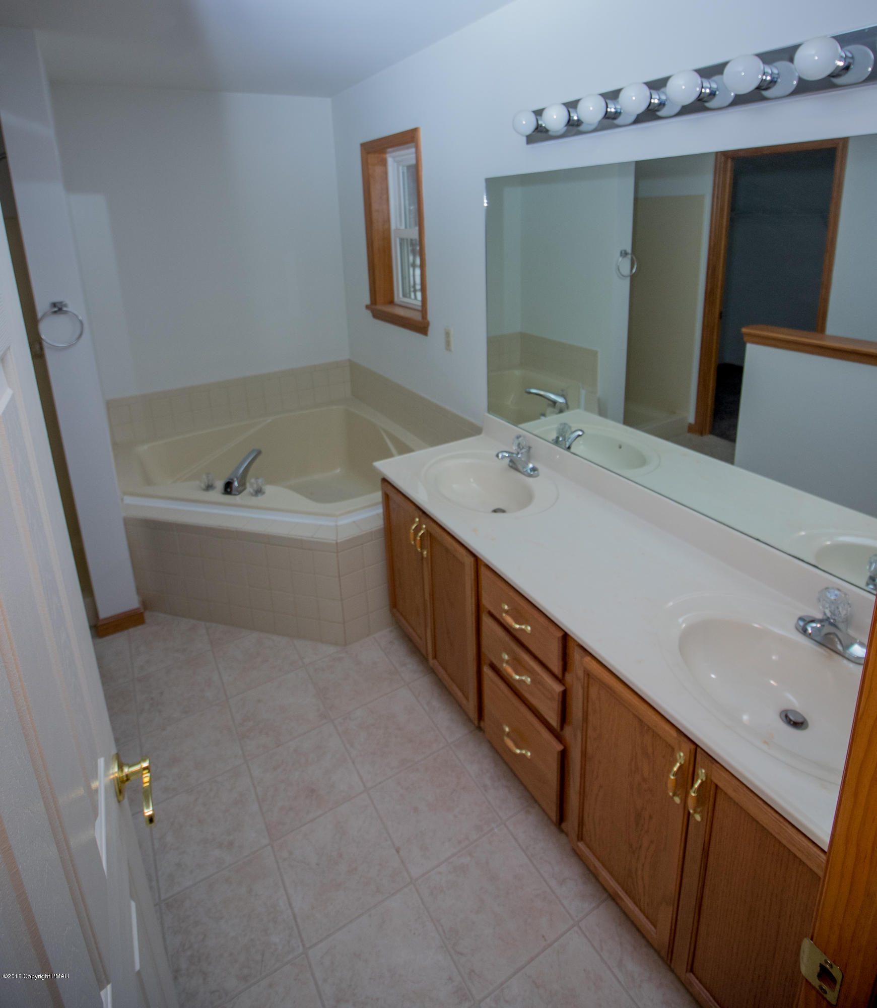 186 Granite Road Long Pond, PA 18334 - Photo 11 of 12 a spacious bathroom with a double vanity sink mirror and bathtub