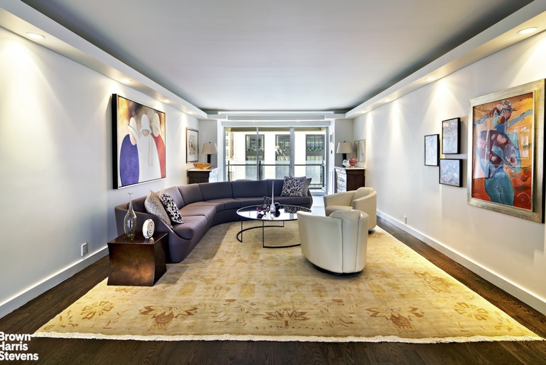 a living room with furniture and window