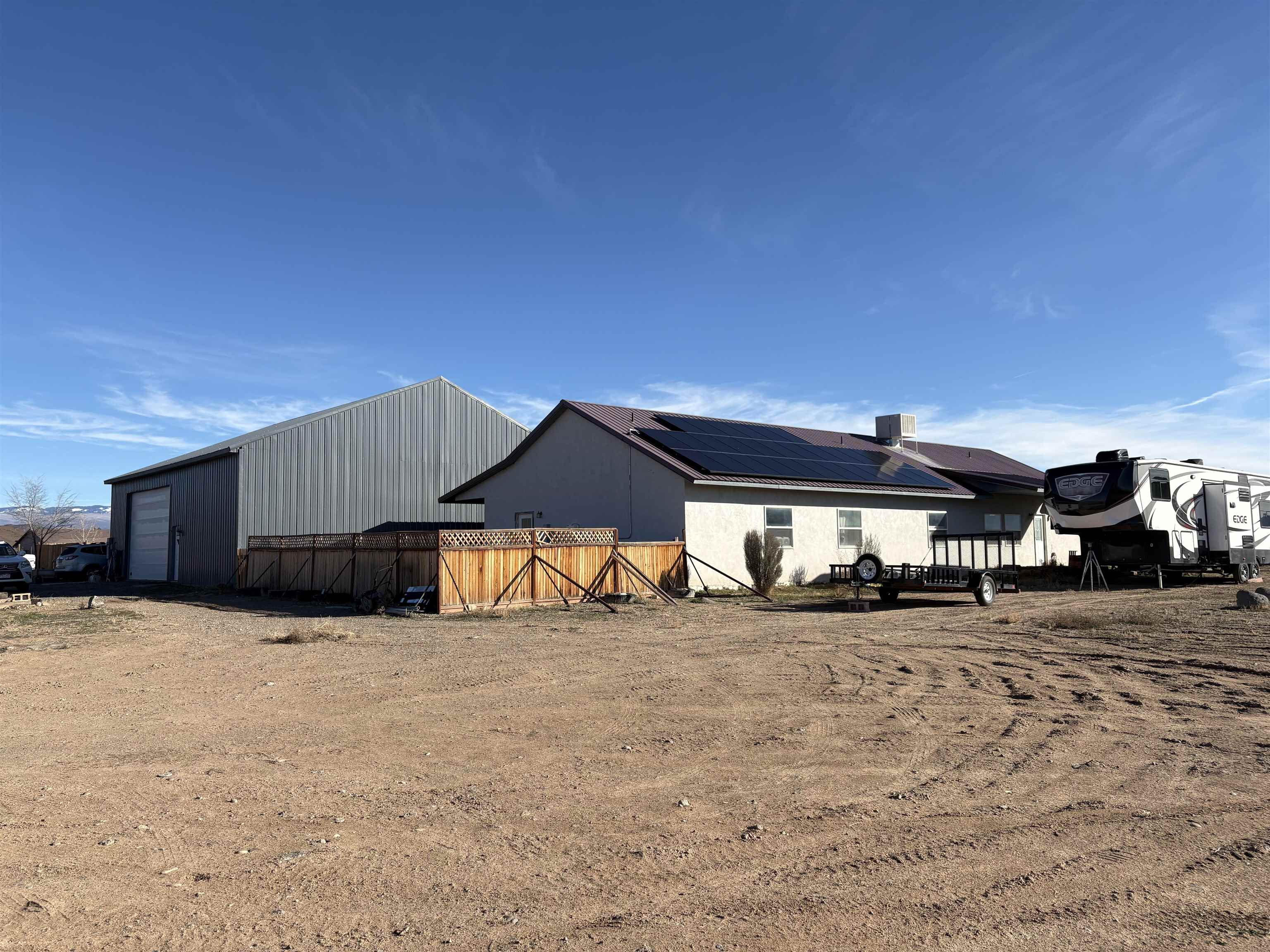 8350 2085 Road Austin, CO 81410 - Photo 2 of 5 a view of a house with a yard
