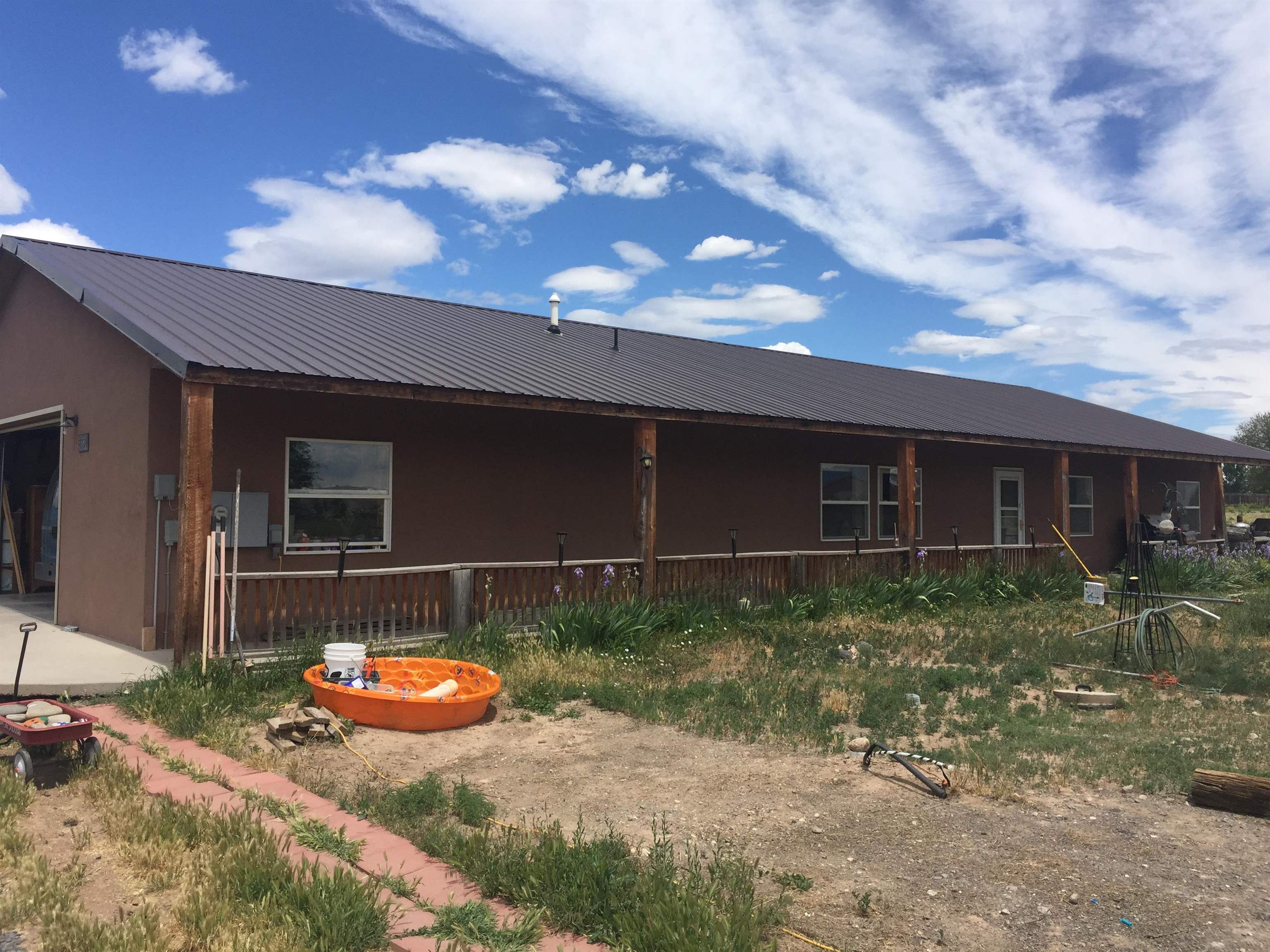 8350 2085 Road Austin, CO 81410 - Photo 3 of 5 a view of a backyard with hardwood area