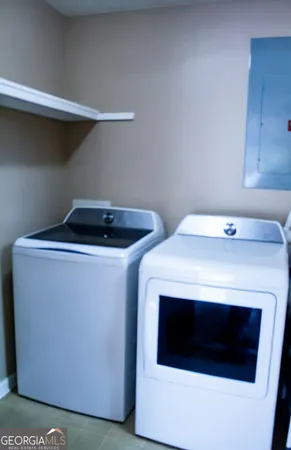 a utility room with dryer and washer