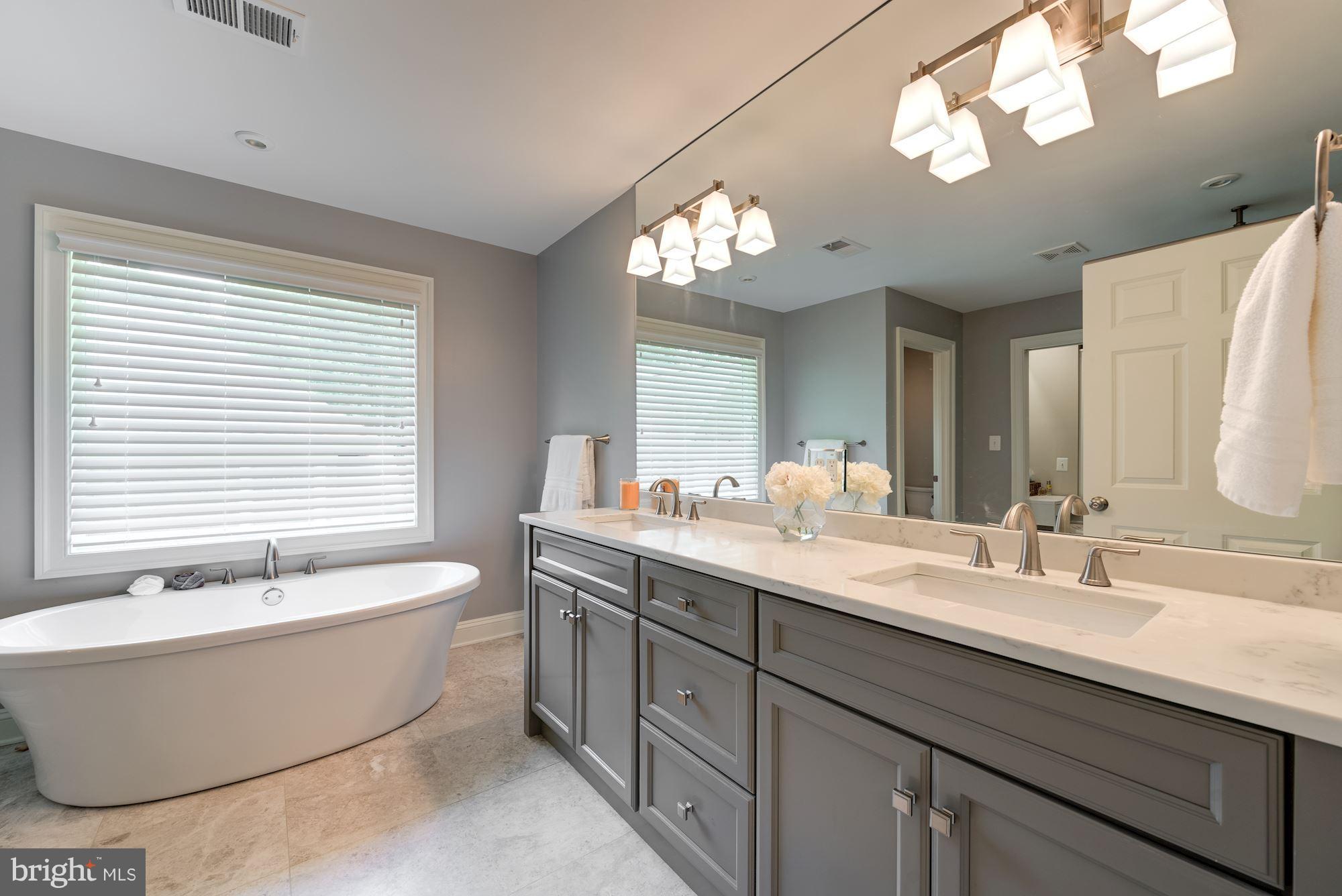 6834 St Albans Road McLean, VA 22101 - Photo 15 of 30 Soaker tub and quartz countertops in master bath