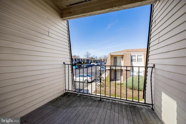 a view of a balcony with wooden floor