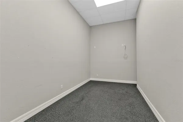 a view of a hallway with a window