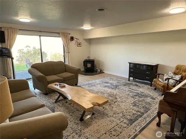 a living room with furniture rug and window