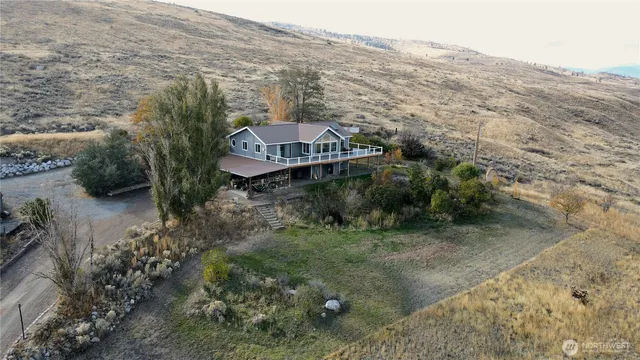 a aerial view of a house with a yard